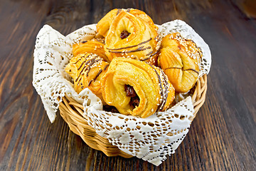 Image showing Cookies with dates in basket on dark board