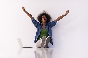 Image showing african american woman sitting on floor with laptop