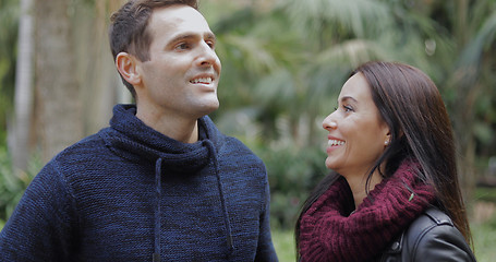 Image showing Loving young couple looking up into the air