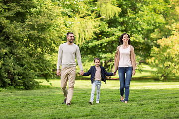 Image showing happy family walking in summer park