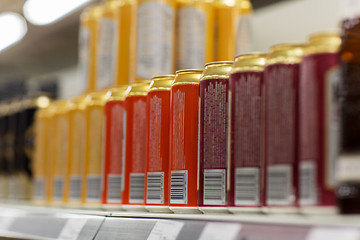 Image showing close up of beer or cider cans at liquor store