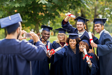 Image showing students or bachelors photographing by smartphone