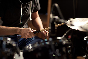 Image showing male musician playing drums and cymbals at concert