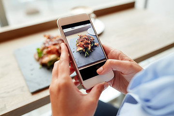 Image showing hands with smartphone photographing food