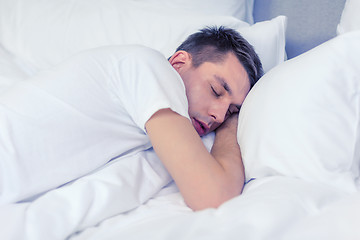 Image showing handsome man sleeping in bed