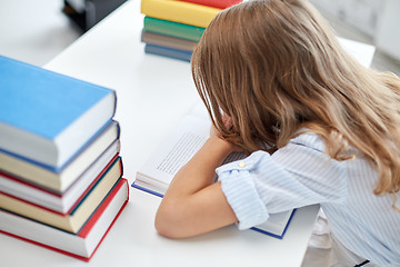 Image showing close up of student girl with many books at school