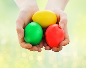 Image showing close up of child hands holding easter eggs