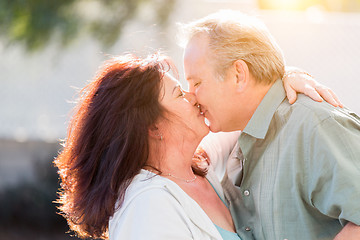 Image showing Middle Aged Couple Enjoy A Romantic Slow Dance and Kiss Outside