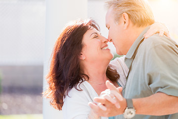 Image showing Middle Aged Couple Enjoy A Romantic Slow Dance Outside