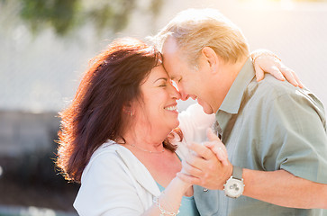 Image showing Middle Aged Couple Enjoy A Romantic Slow Dance Outside