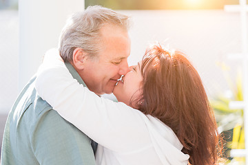 Image showing Middle Aged Couple Enjoy A Romantic Slow Dance and Kiss Outside