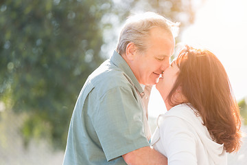 Image showing Middle Aged Couple Enjoy A Romantic Slow Dance and Kiss Outside