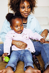 Image showing adorable sweet young afro-american mother with cute little daugh