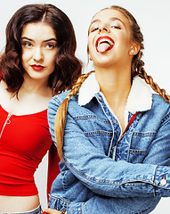 Image showing best friends teenage girls together having fun, posing emotional on white background, besties happy smiling, lifestyle people concept 