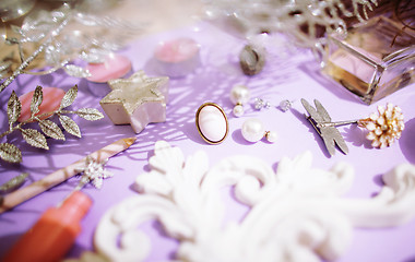 Image showing Jewelry table with lot of girl stuff on it, little mess in cosmetic brushes, women interior concept, perfume elegance things, little princess makeup