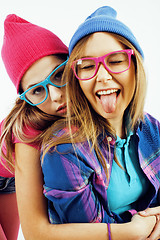 Image showing lifestyle people concept: two pretty stylish modern hipster teen girl having fun together, happy smiling making selfie 