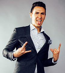 Image showing young pretty business man standing on white background, modern hairstyle, posing emotional, lifestyle people concept 