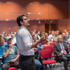 Image showing Public speaker giving talk at Business Event.