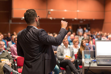 Image showing Public speaker giving talk at Business Event.