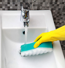 Image showing housework in yelow glove