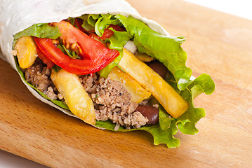 Image showing beef burrito with peppers, fried potato and tomato