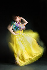 Image showing beautiful woman in long yellow dress