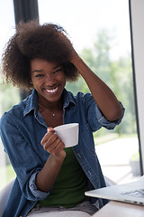 Image showing African American woman in the living room