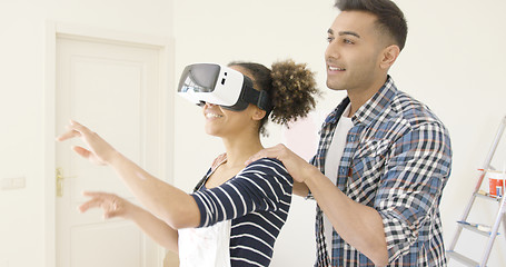 Image showing Woman in overalls and virtual reality glasses