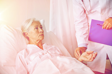 Image showing doctor checking senior woman pulse at hospital