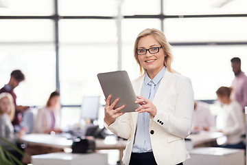 Image showing businesswoman with tablet pc computer at office