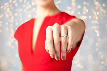 Image showing close up of woman showing hand and engagement ring