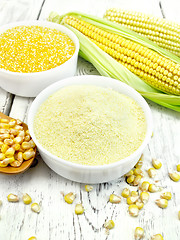 Image showing Flour and grits corn in bowls with cobs on board