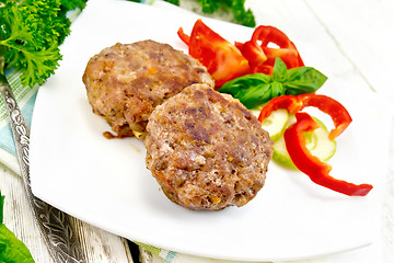 Image showing Cutlets stuffed with basil in plate on light board