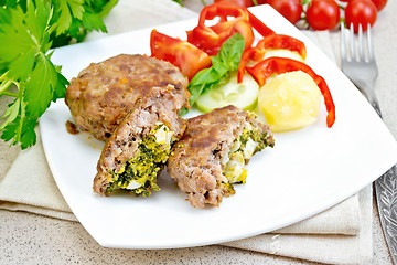 Image showing Cutlets stuffed in plate on stone table