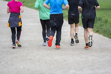 Image showing Fitness sport Group of people running jogging outside on road