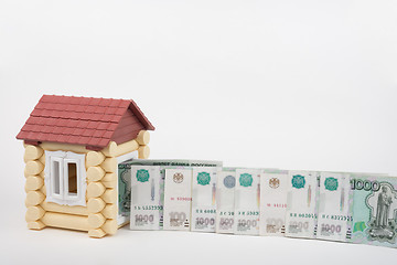 Image showing Before the house lined up Russian rubles banknotes of different denomination, white background