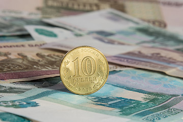 Image showing On the Russian paper banknotes standing on the edge of Russian ten-coin
