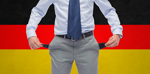 Image showing close up of german businessman with empty pockets