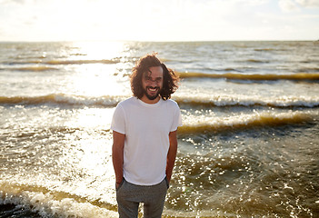 Image showing happy man in white t-shirt on beach over sea