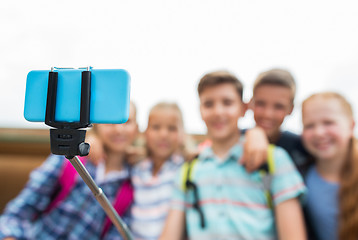 Image showing happy elementary school students taking selfie