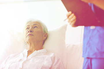 Image showing nurse and senior woman patient at hospital