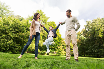 Image showing happy family walking in summer park and having fun