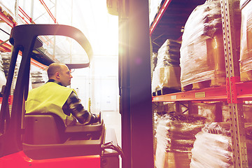 Image showing man operating forklift loader at warehouse