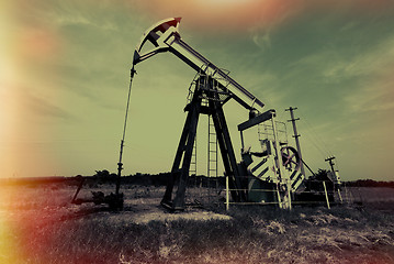 Image showing oil jack against sky