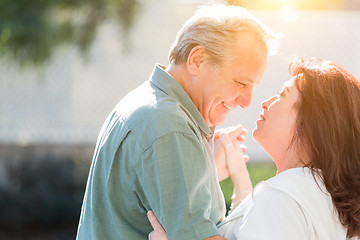 Image showing Middle Aged Couple Enjoy A Romantic Slow Dance Outside