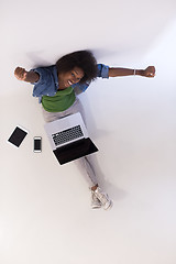 Image showing african american woman sitting on floor with laptop top view