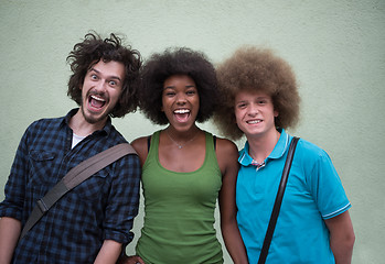 Image showing multiethnic group of happy three friends