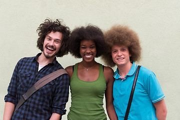 Image showing multiethnic group of happy three friends