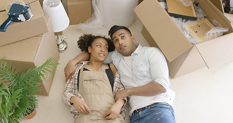 Image showing Dreaming young couple lying on the floor