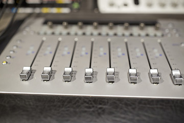 Image showing music mixing console at sound recording studio